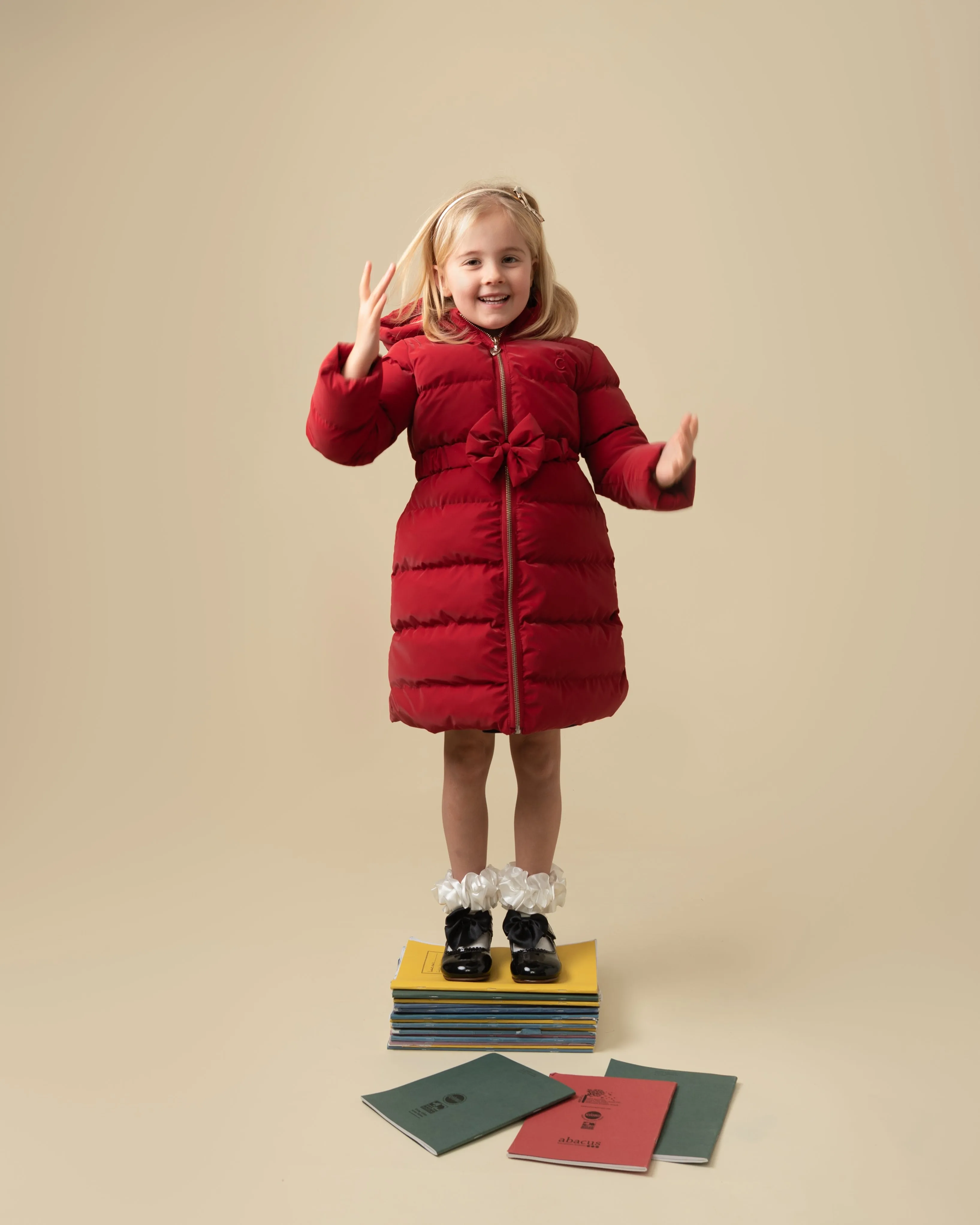 Caramelo Kids Girls Red Matt Puffer Jacket with Belt and Bow trim